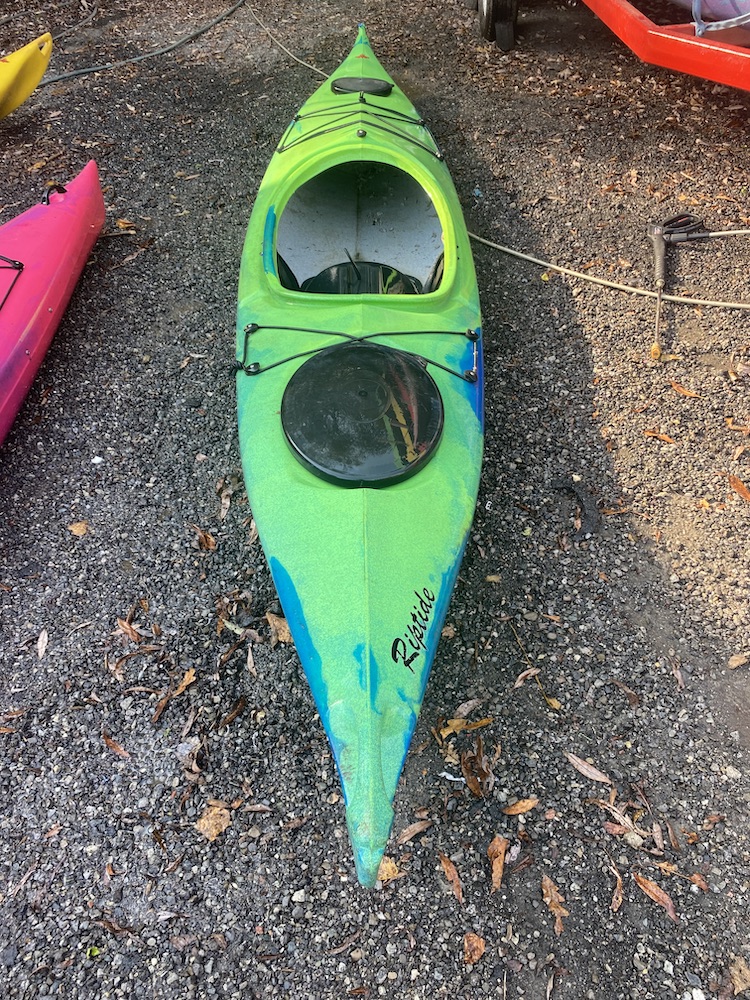 a close up of a kayak in a parking lot